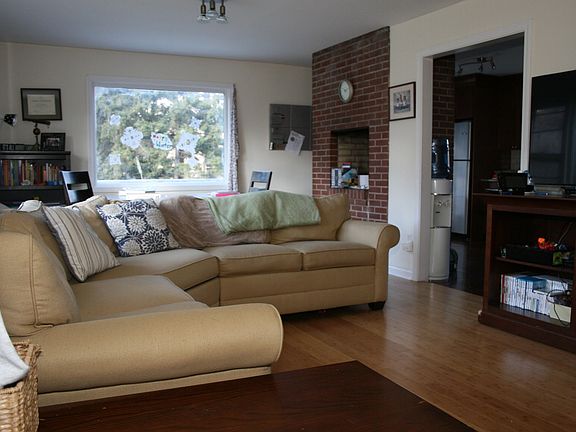 Natural light fill the living room, open to the kitchen/eati