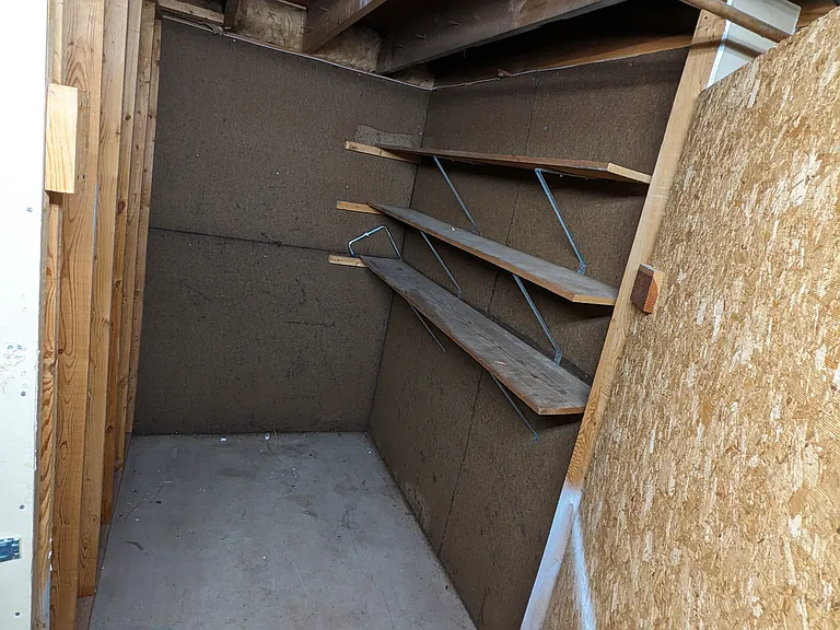 Storage space. Door closes and can be padlocked.