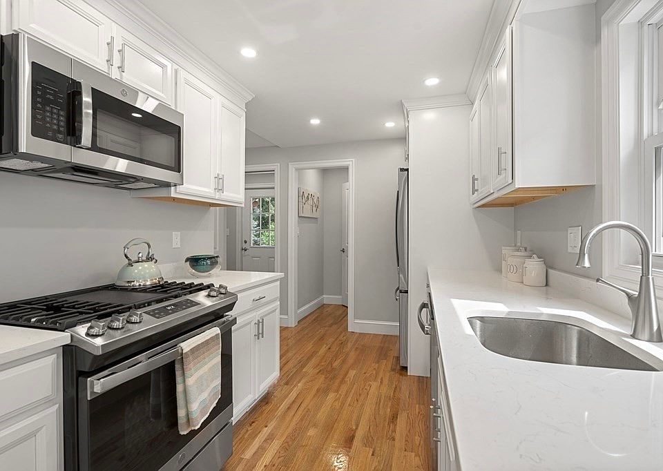 A new renovated kitchen with gas-connected stove, microwave, oven, and dishwasher. With a window in the kitchen to allow fresh air come in.