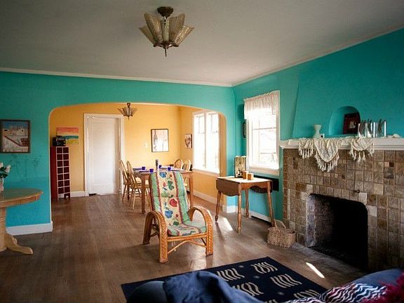 Tiled fireplace has a niche above the generous mantle.