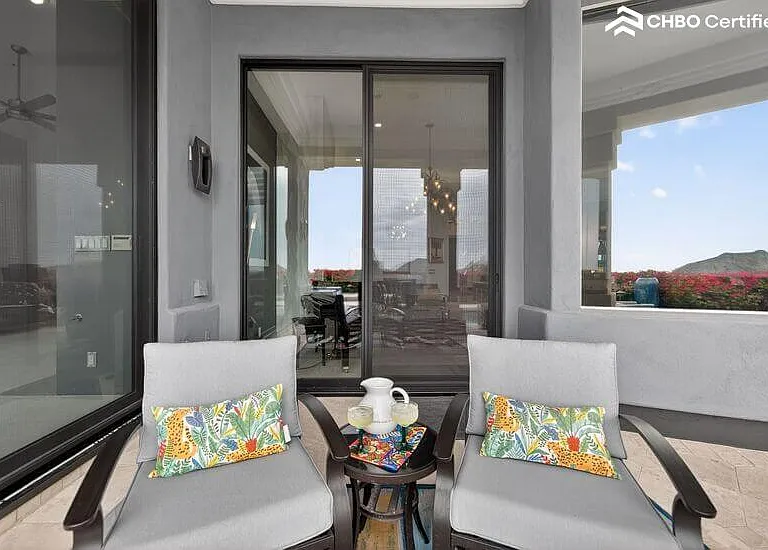 Pool & mountain view swivel rockers on primary patio
