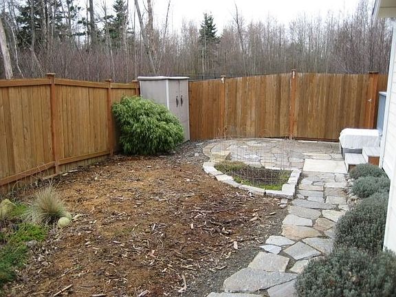 Side yard w/patio for entertaining!