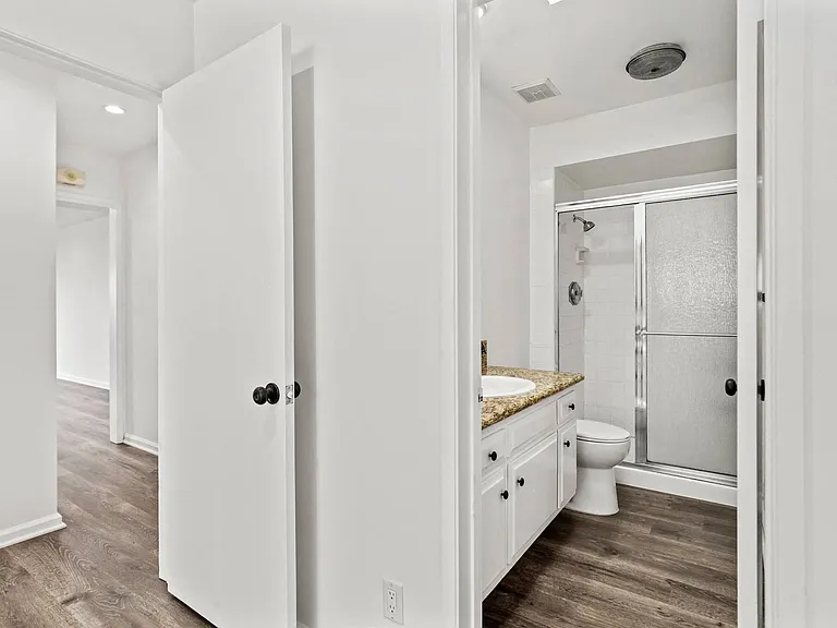 Bedroom with Bathroom with Shower Bath and Glass Door