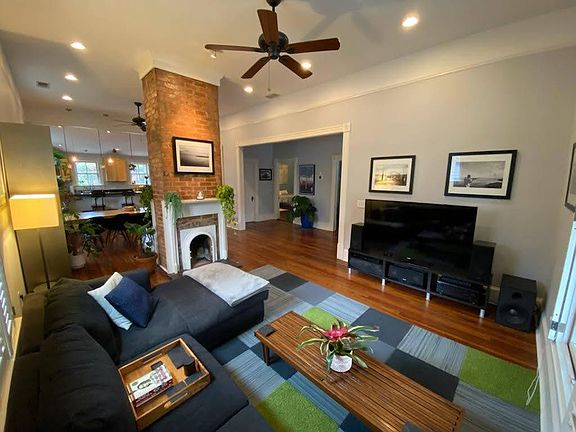 Open living room with dining area and kitchen in the back