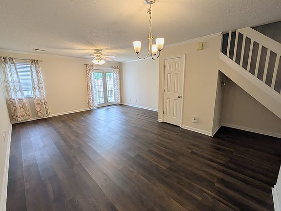 Dining and living Area with coat closet and storage