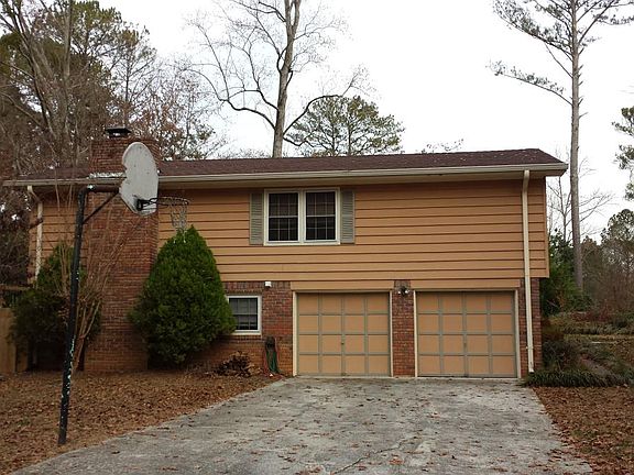 Side, 2 car garage with remotes- old paint shown