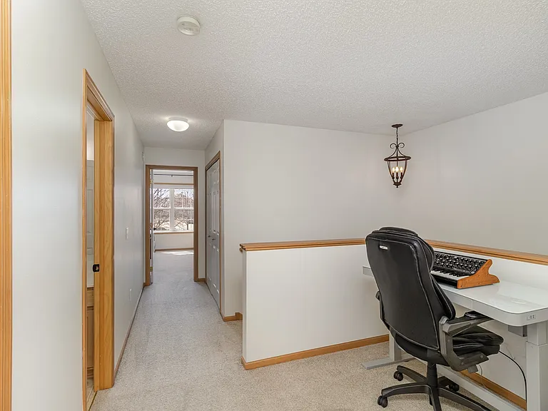 The loft, located at the top of the stairs, is located next to bedrooms 2 and 3.