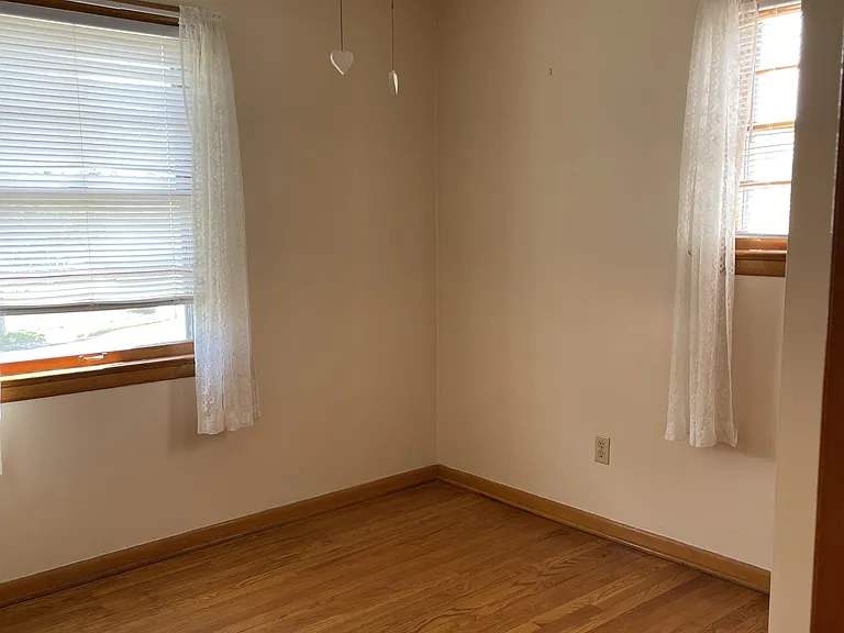 Small bedroom has two smaller closets. And two windows