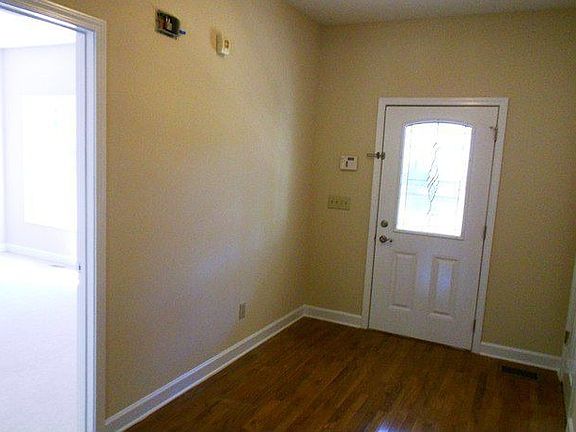 Formal entry way with hardwood floors