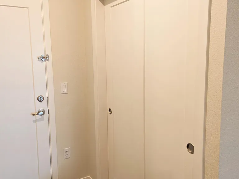 Front door entrace, coat closet.