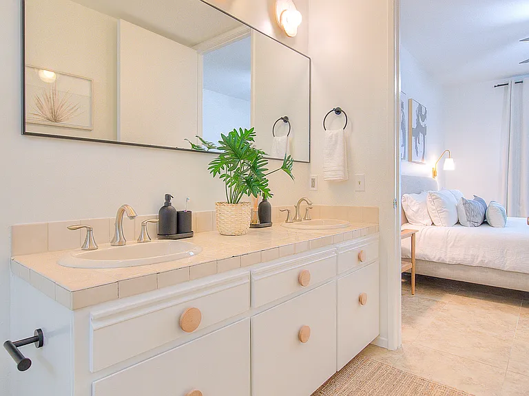 Primary ensuite bathroom with double vanity