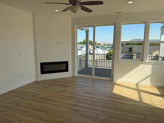 Enjoy the elcetric fireplace in the living area