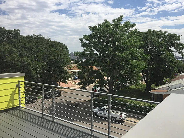 roof deck w/ partial city view