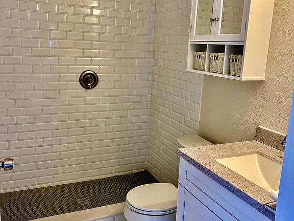 Subway Tile shower with classic penny tile floors