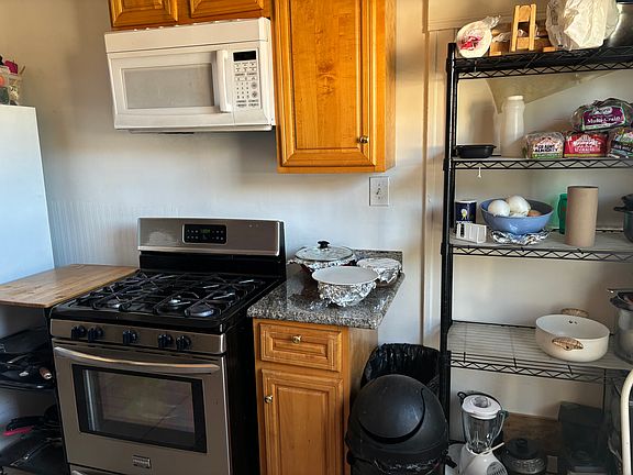 Kitchen with Gas Stove, Dishwasher, Microwave and large Refrigerator