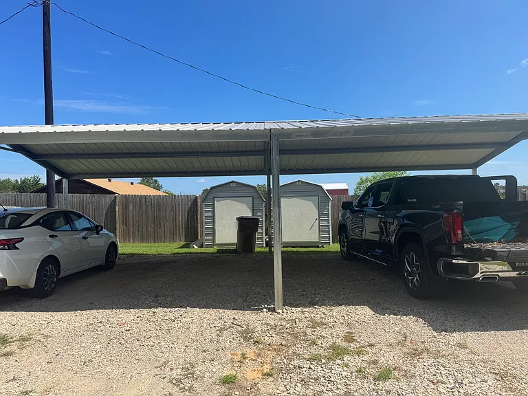 Covered parking with personal storage building