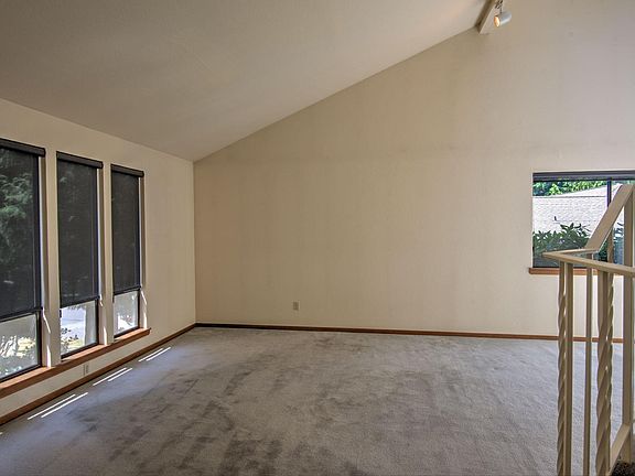 Formal living room with vaulted ceilings.