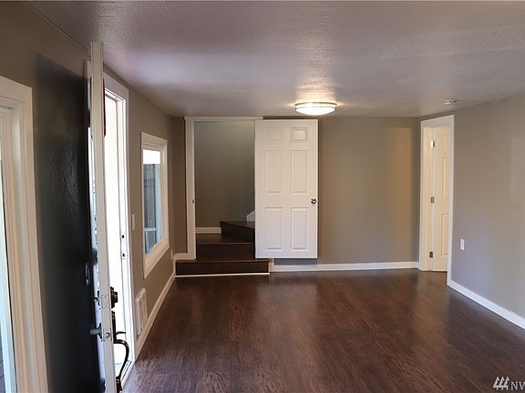 Stairs off of Living Room Leading to a Large Bedroom or Possible Bonus Room. Make it Whatever You Want!