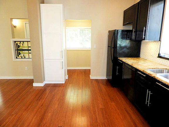 View looking past the kitchen into the breakfast nook