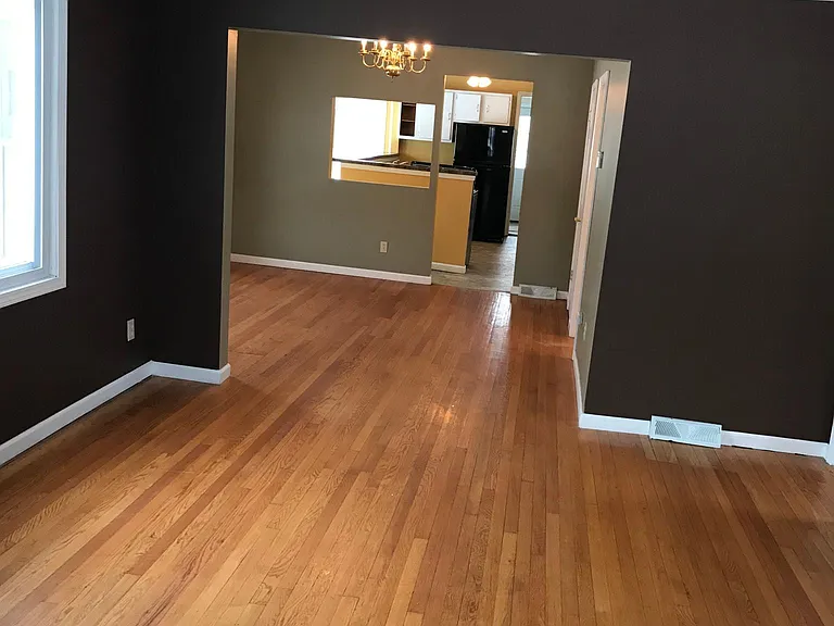BIG LIVING ROOM AND DINING ROOM VIEW LOOKING BACK
