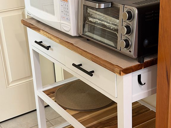 cart with microwave and toaster oven