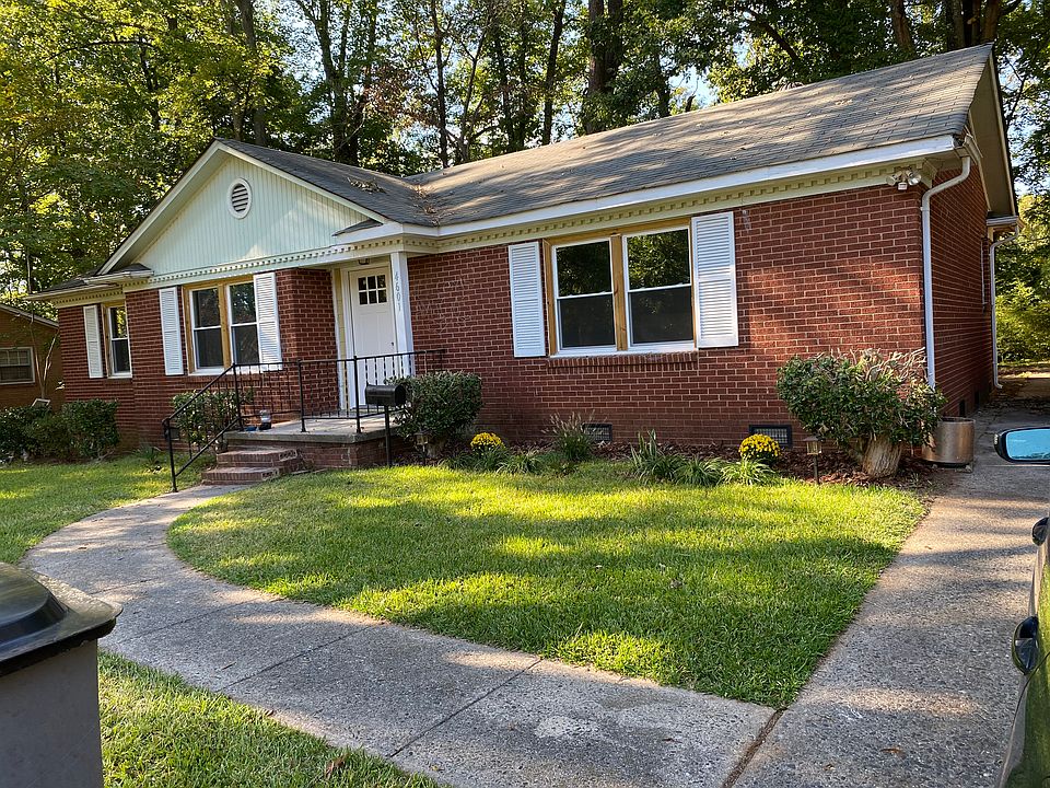 Brick Ranch Style home, large front and large wooded back with screened porch