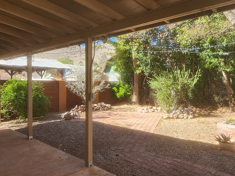 Back porch view of backyard with patio area