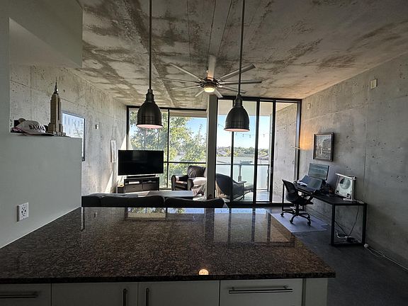 Large industrial fan & upgraded light fixtures with smart bulbs.