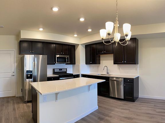 Beautiful kitchen, dining room, living room located on the main floor of condo. There is also a half bathroom located on this floor.