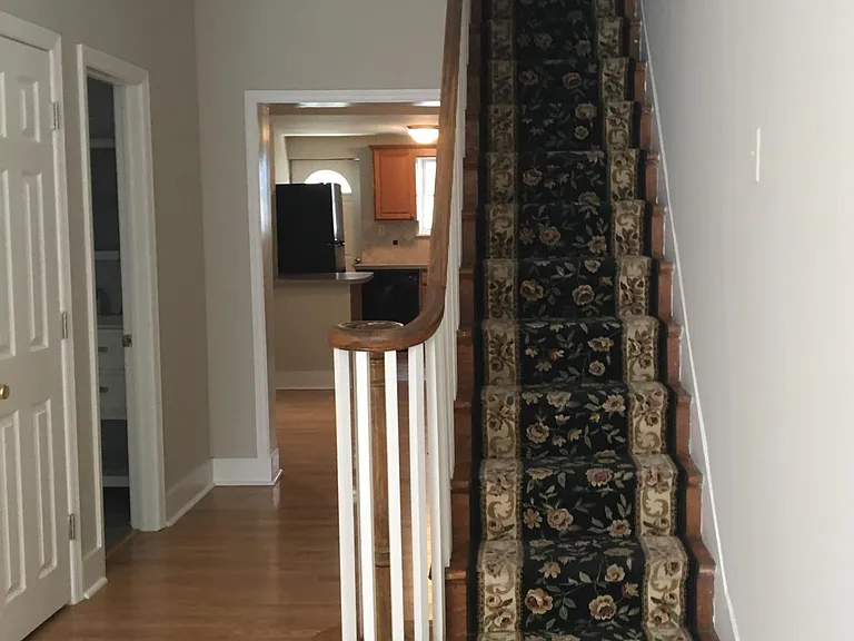 Closet and full bath on left lead to dining room, kitchen and patio.
