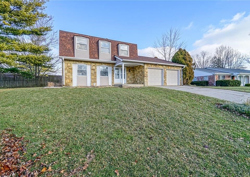 Large front yard and mature trees welcome you home!