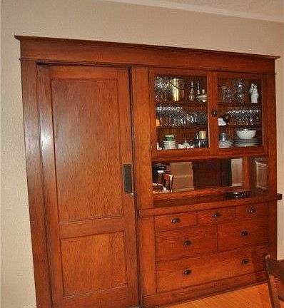 Built-in hutch in the dining room offers the period details of 1920. Note the butler door from the d