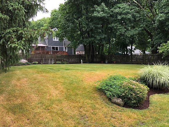 Desirable upper floor unit of a beautiful multi-family home with a great backyard, an inviting deck, and in a great location in the heart of North Easton.