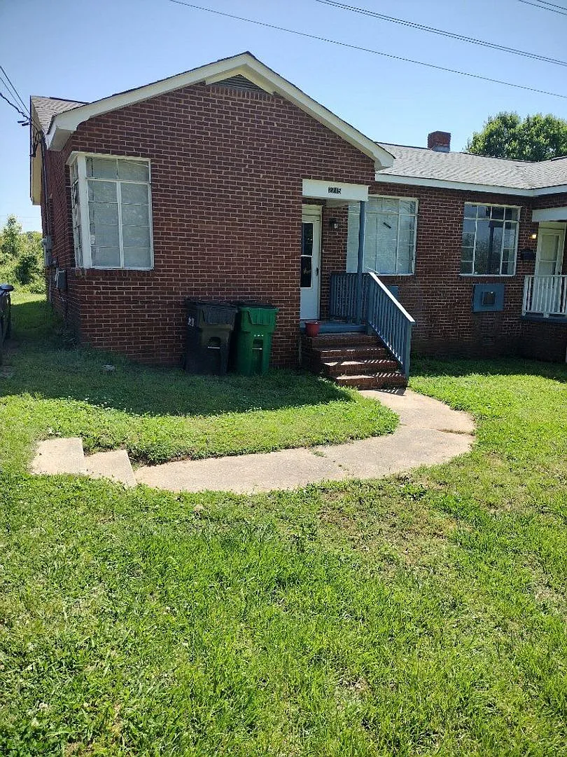 This 2 bed 1 bath duplex home is all brick located near Remount Rd and West Blvd. — Photo 1