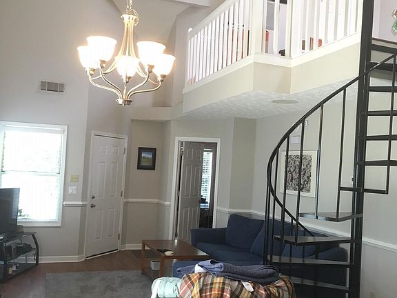 Open plan with vaulted great room , spiral staircase to overlooking loft