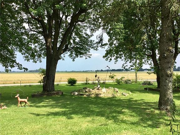 View from covered front porch overlooking open field to the east.