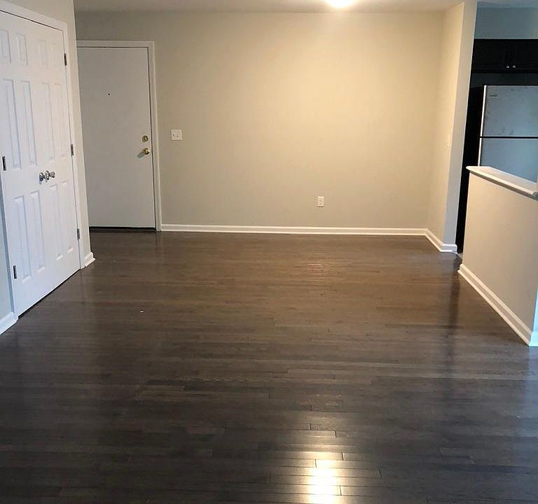 View of front door and partial view of closet space. This space can be used as a dining room area or just an open area.