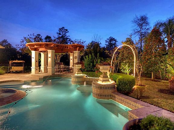  Extravagant outdoor paradise - unlike any other! Complete with Grecian-style heated saltwater pool, cascading edge spa, breathtaking fountains, & pagoda-style gazebo - PLUS enormous covered travertine patio!