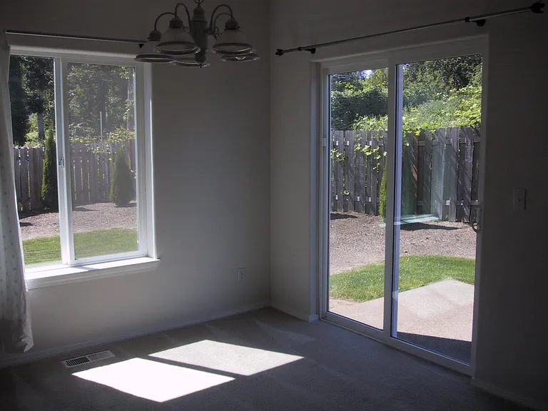 dining room view of the back and side yard