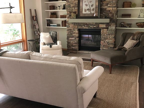 Quarter sawn floors, stacked stone gas fireplace, floor to ceiling windows. Views of pond, creek and willows.