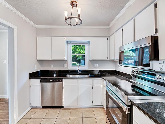 Newly upgraded kitchen with granite and stainless steel appliances