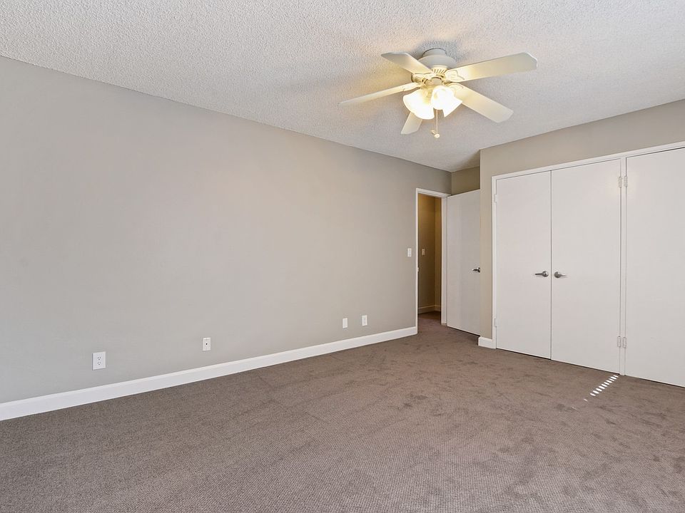 Bedroom with carpet flooring, double 2-door closets