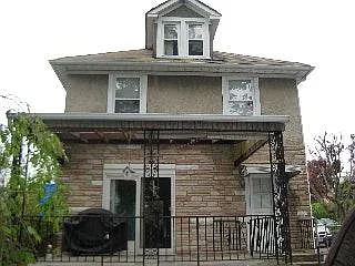 back of house with covered patio