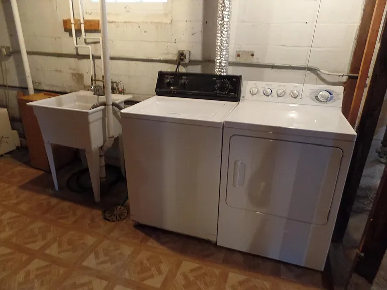 Washer and dryer in basement.