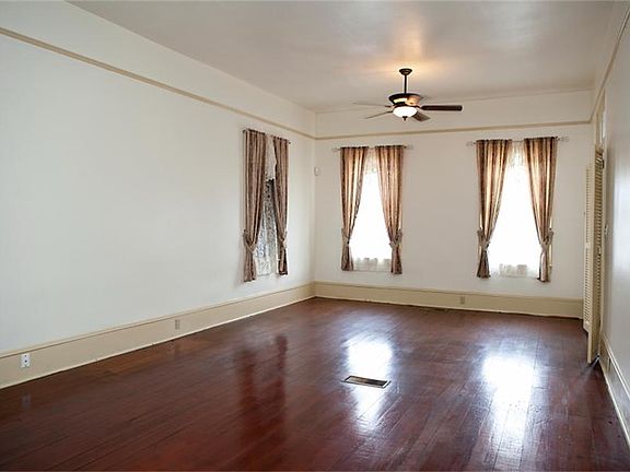Large living area with high ceilings.