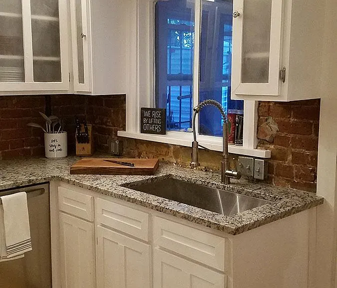 Granite countertop, refinished hardwood floors, extra-wide and deep sink.
