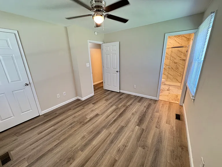 Master bdrm - looking at bathroom on the right, additional closet on the left, door in the middle
