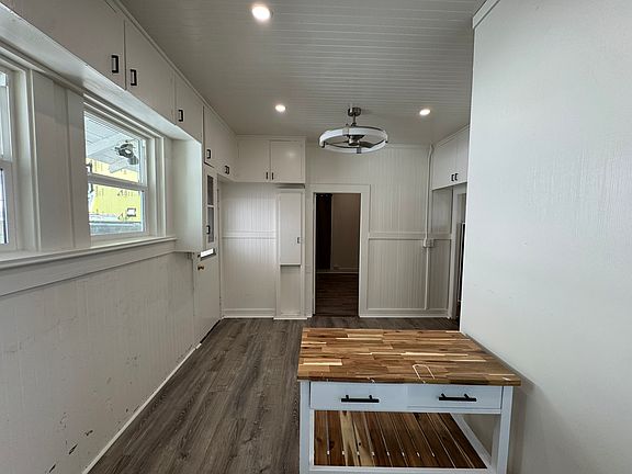 Open living area with plenty of built-in storage cabinetry.