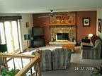 Family room with woodburning fireplace