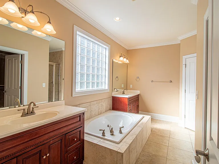 Master Bathroom with tub and shower